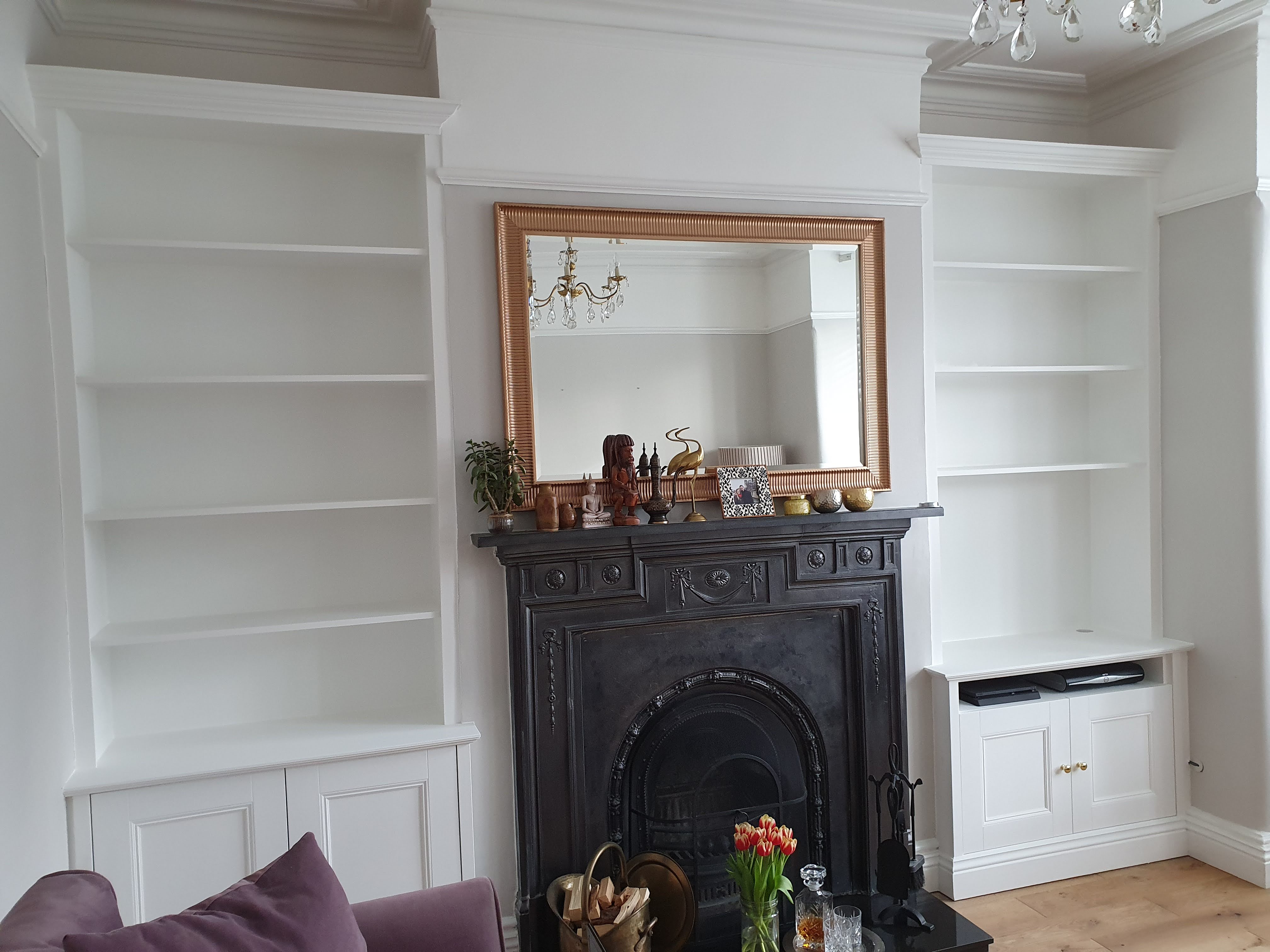Traditional Hague Blue alcove unit with shaker doors and open shelving in a living room.