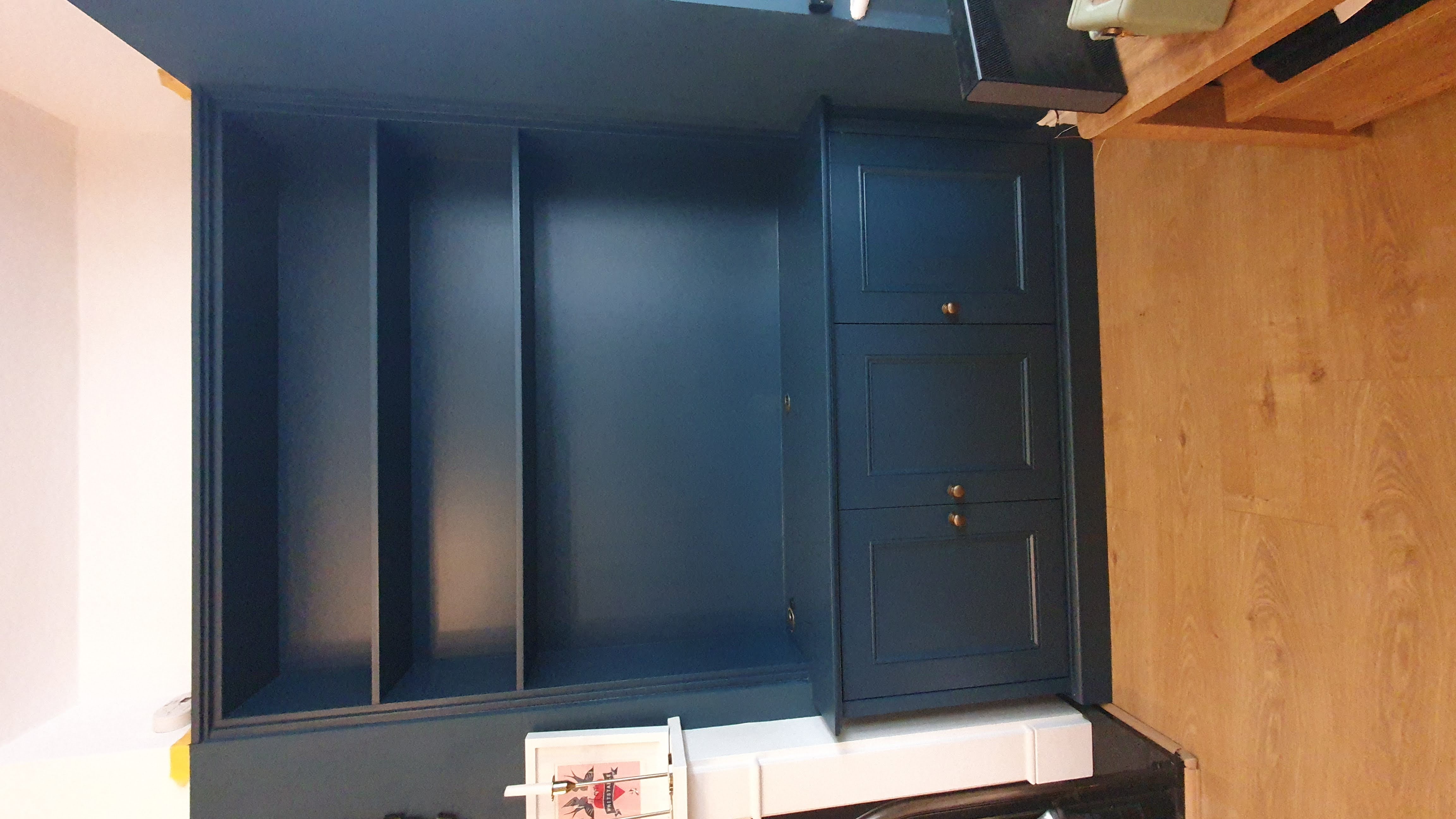 Traditional Slaked Lime painted alcove units with shelving and base cabinets in a living room.