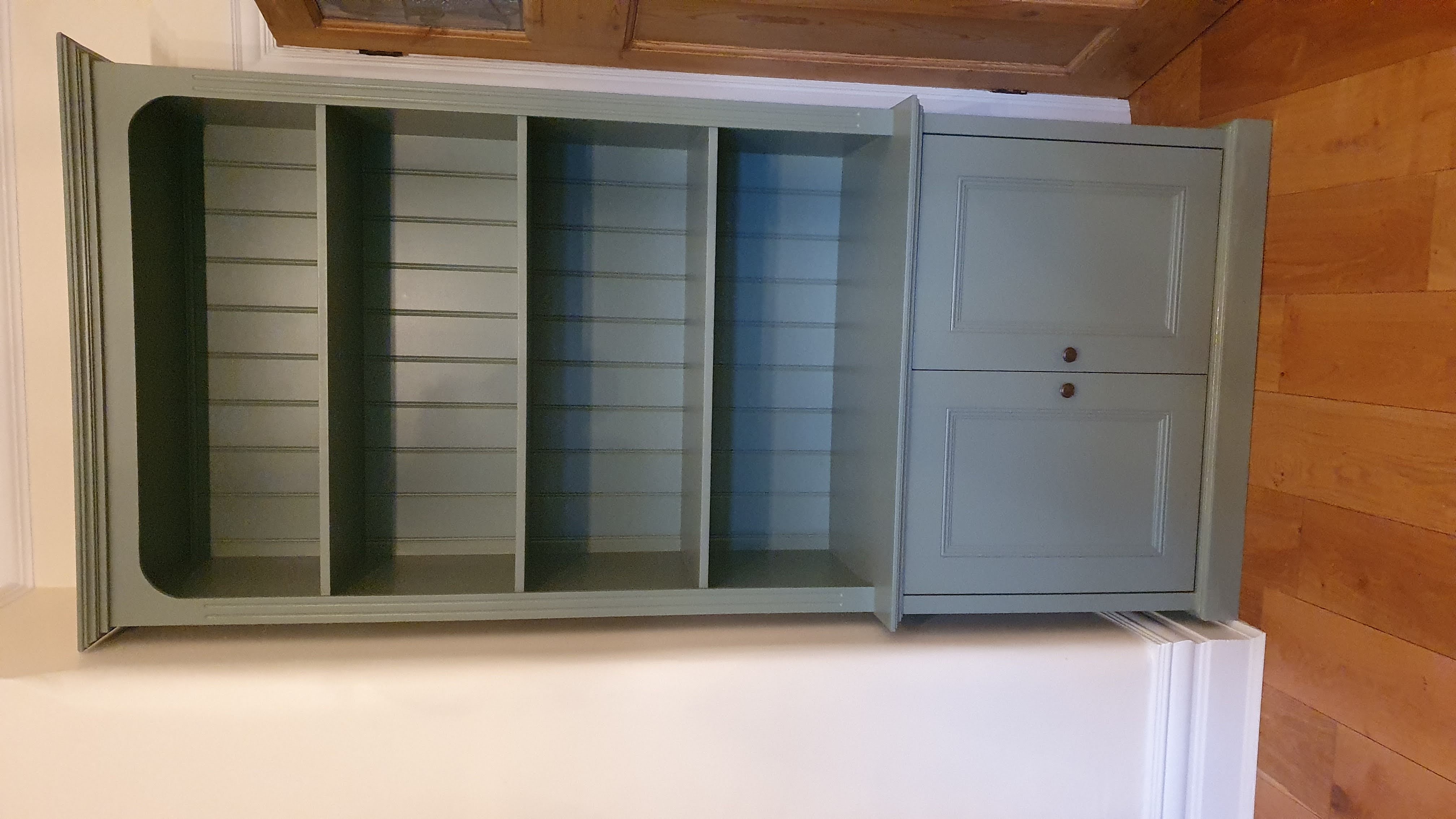 Traditional Hague Blue alcove units with shelving and Shaker style cabinets in a living room.