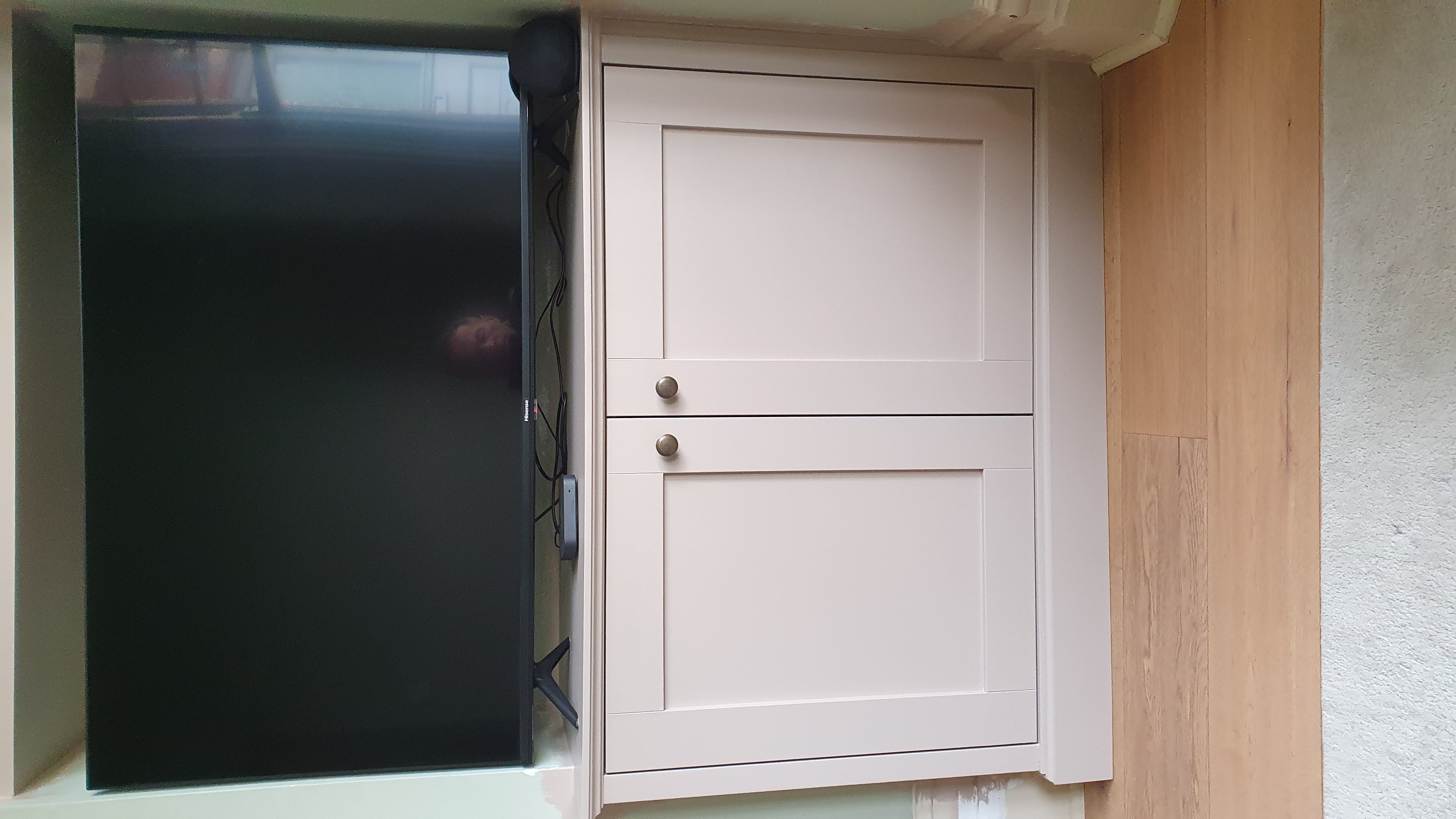 Traditional fitted shelving unit in Farrow and Ball Green Smoke with tongue and groove back panel, perfect for living room storage
