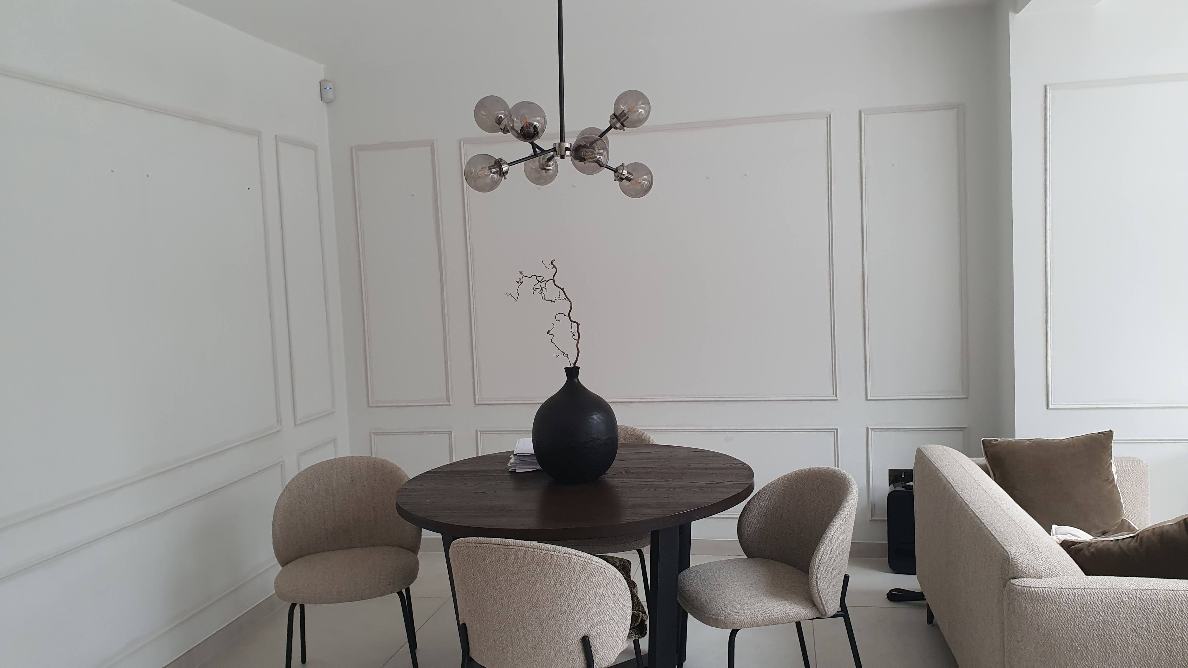 Traditional white fitted wall panelling in a living room