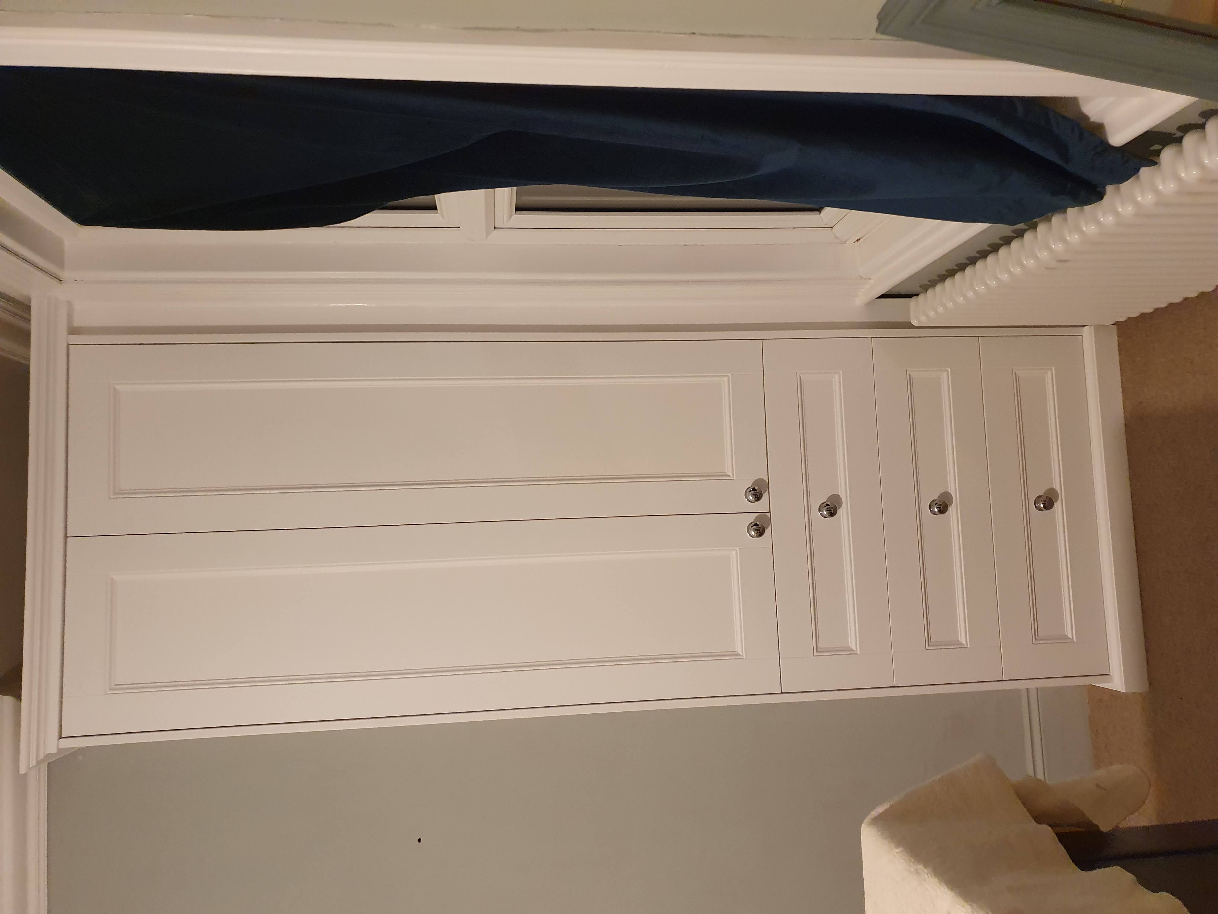Fitted Shaker style wardrobe in Shaded White, perfect for a modern bedroom.